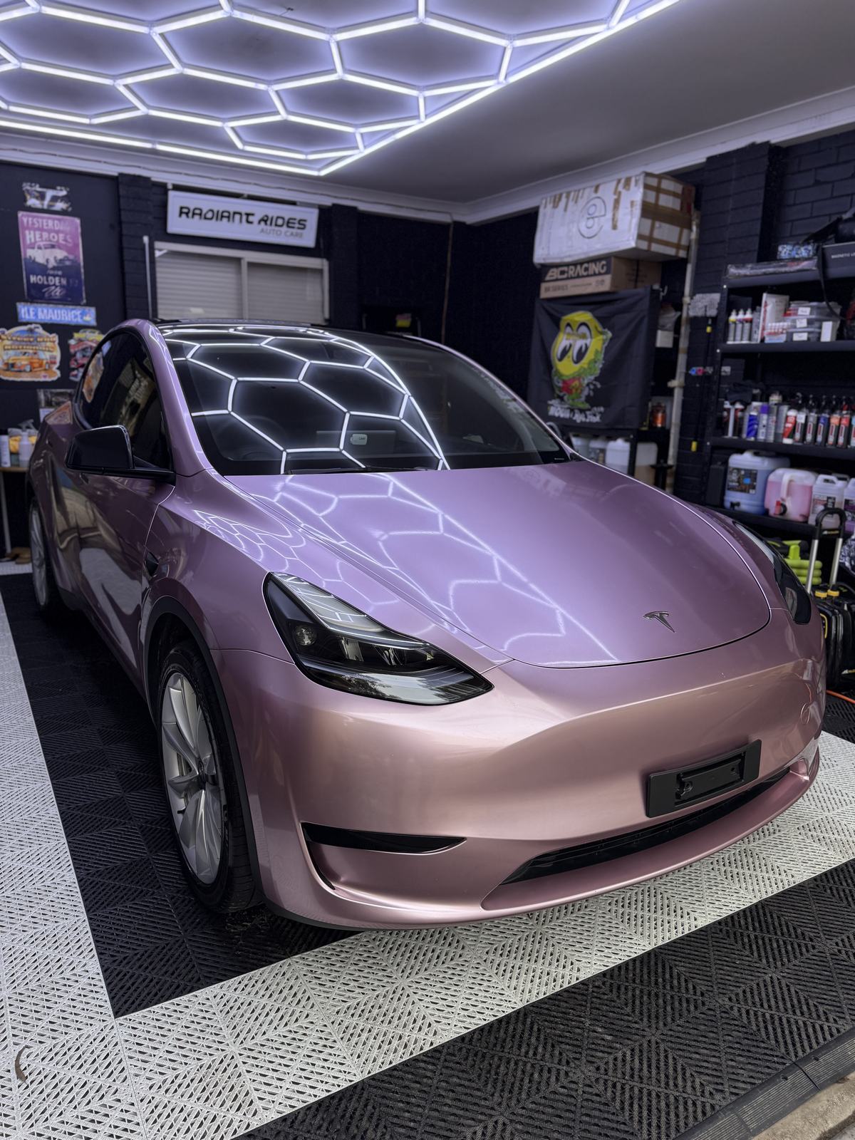 Wrapped Tesla Model Y under the studio lights