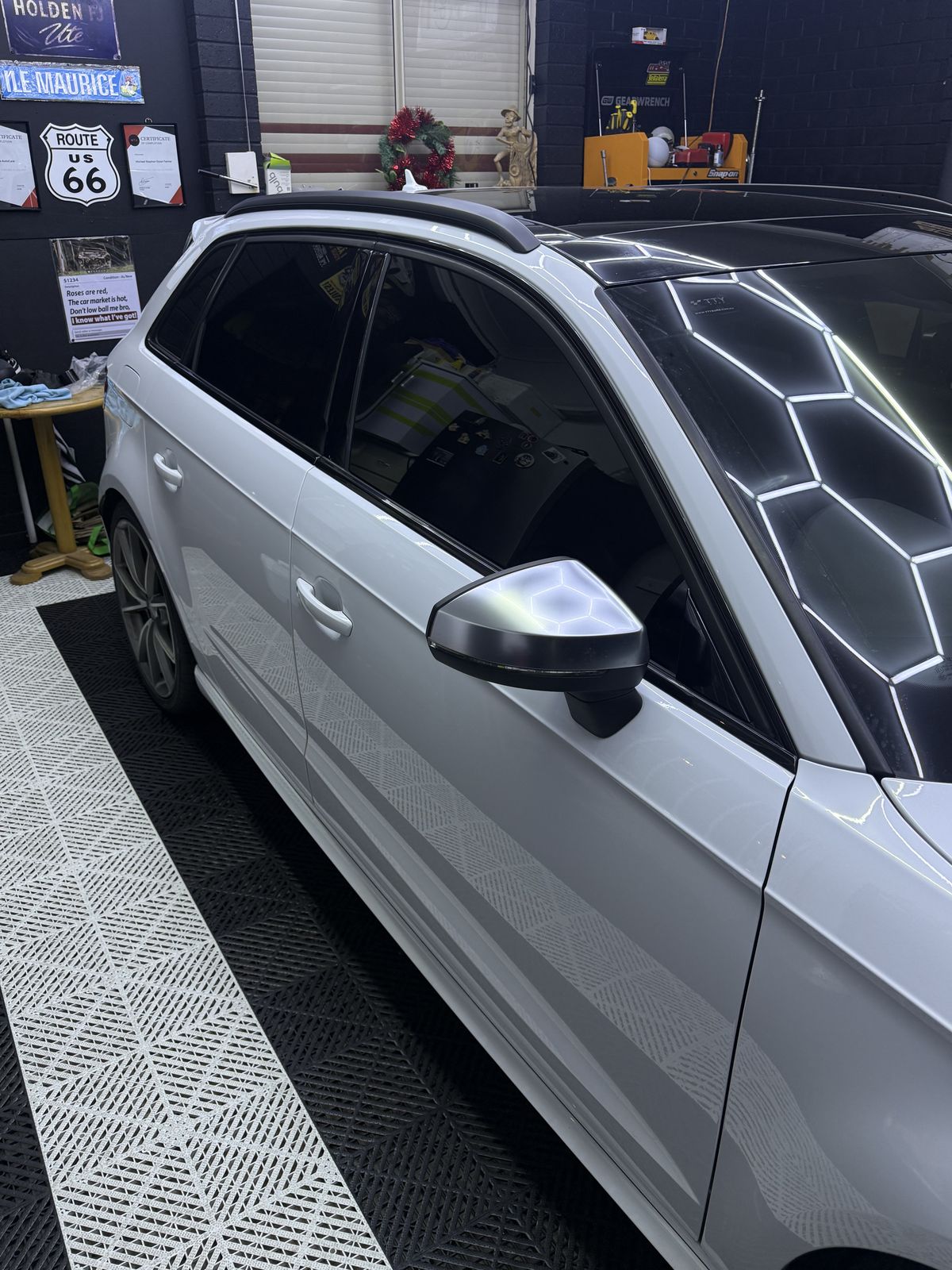 Tinted front and rear side windows on a white Audi S3
