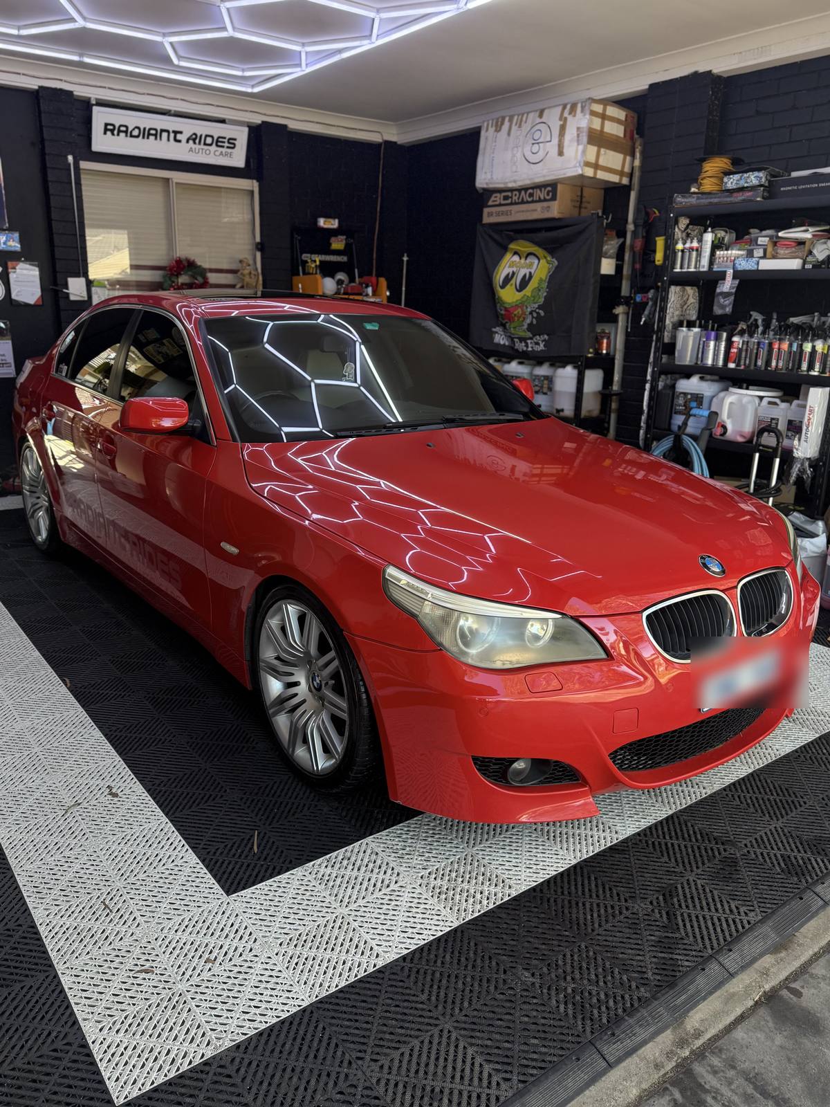 Red BMW 5 Series after window tinting at the Cranbourne North studio